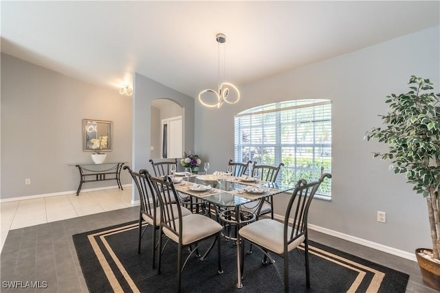 dining room with dark tile patterned flooring