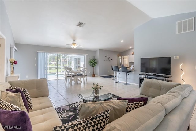 tiled living room with vaulted ceiling and ceiling fan