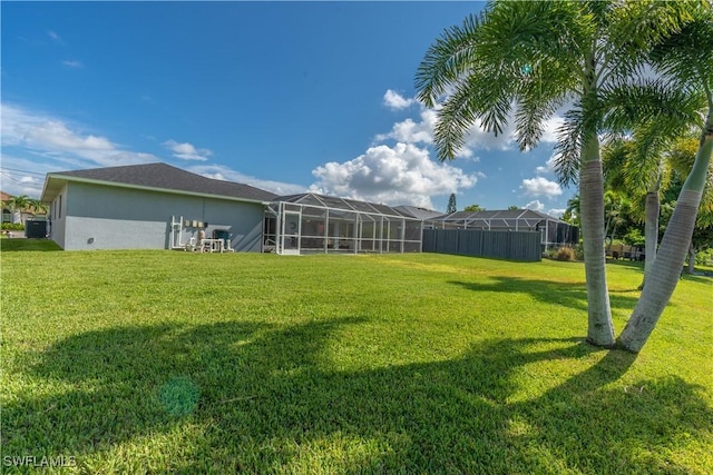 view of yard with a lanai