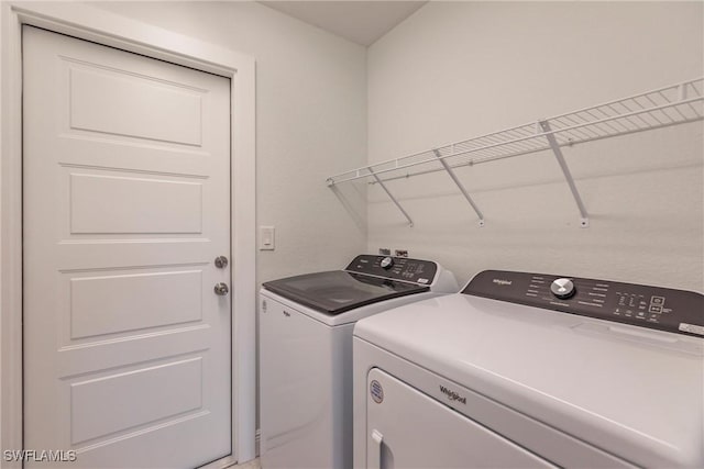 laundry room with separate washer and dryer