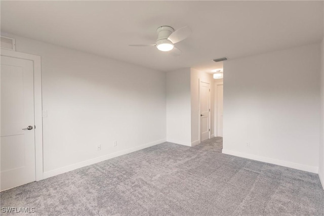 empty room with carpet flooring and ceiling fan