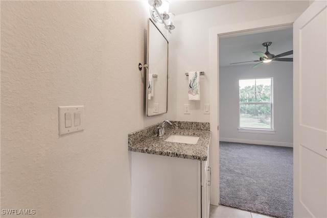 bathroom featuring ceiling fan and vanity