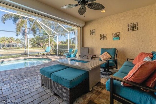 exterior space featuring ceiling fan and a lanai