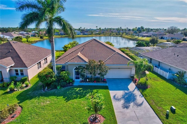 birds eye view of property with a water view