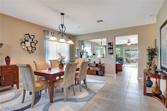 dining area featuring ceiling fan and light tile patterned flooring