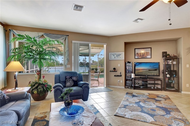 8040 Liriope Loop, Lehigh Acres, FL 33972 - living room featuring tile patterned flooring, ceiling fan, and baseboards
