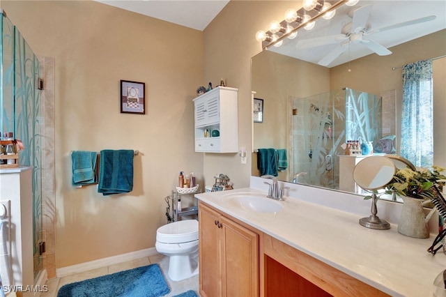 bathroom with tile patterned floors, vanity, toilet, and an enclosed shower