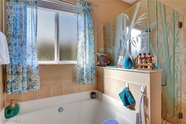 8040 Liriope Loop, Lehigh Acres, FL 33972 - full bath with a stall shower, a bath, and plenty of natural light