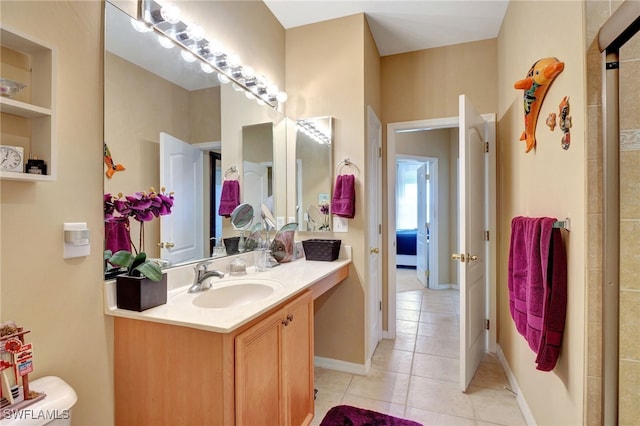 bathroom with vanity, tile patterned flooring, and built in features