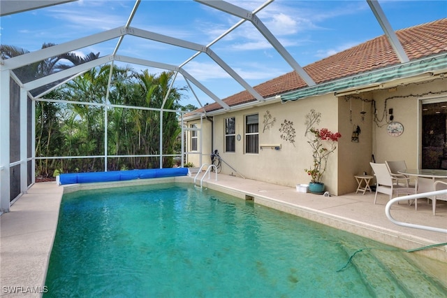 view of pool featuring a lanai and a patio area