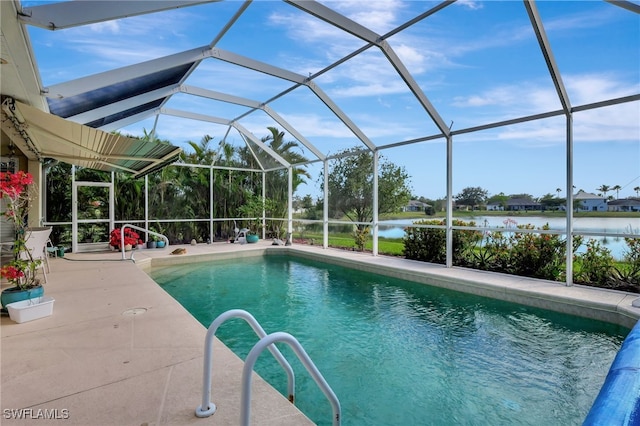 view of pool with a patio area, glass enclosure, and a water view