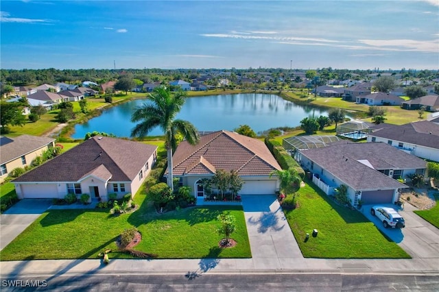 bird's eye view featuring a water view and a residential view