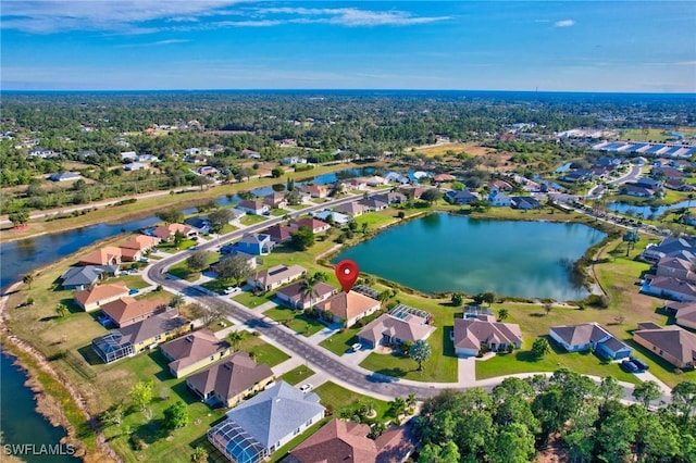 birds eye view of property featuring a water view