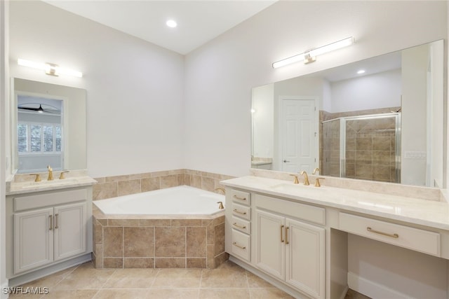 bathroom with tile patterned floors, vanity, ceiling fan, and shower with separate bathtub