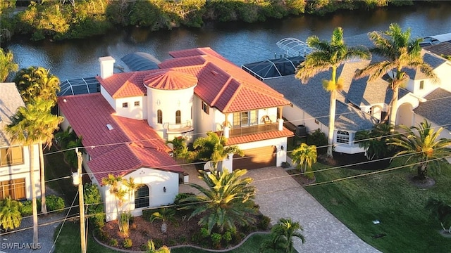 birds eye view of property with a water view