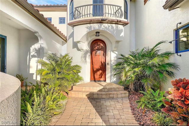 entrance to property with a balcony