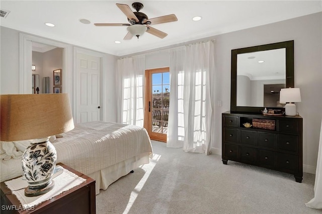 bedroom with ceiling fan, light colored carpet, and access to exterior