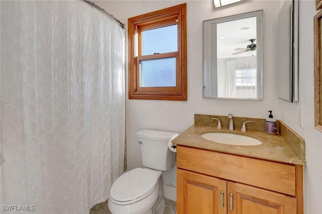 bathroom featuring vanity, ceiling fan, and toilet