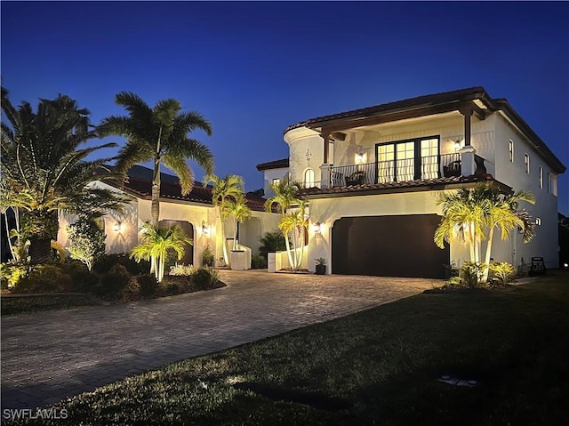 mediterranean / spanish home with a balcony