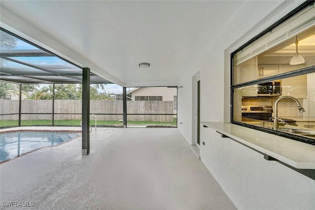 view of pool with a sink