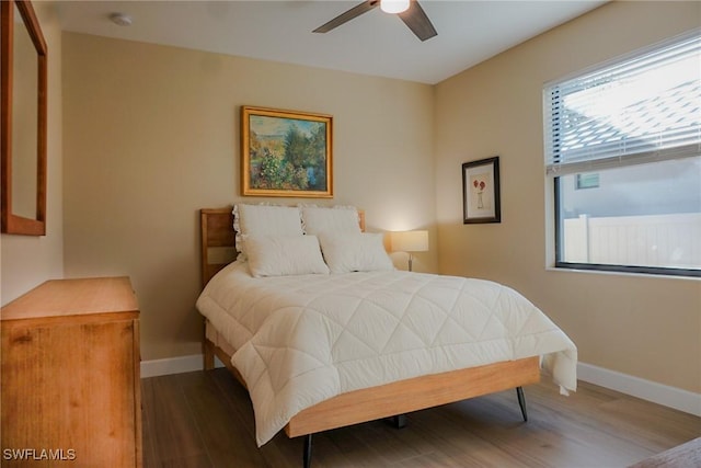 bedroom featuring ceiling fan and hardwood / wood-style floors