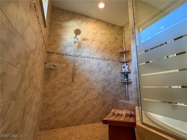 bathroom featuring a tile shower