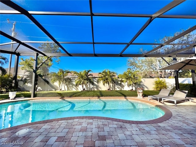 view of pool with a lanai and a patio area