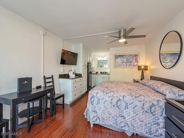 bedroom featuring high quality fridge, ensuite bath, ceiling fan, and dark wood-type flooring