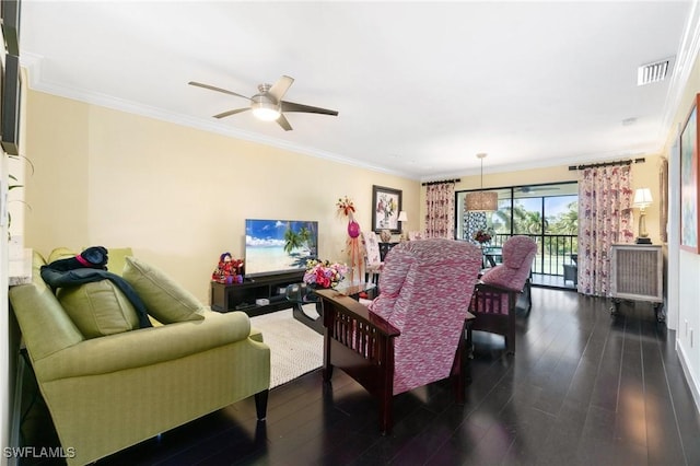 living room with ceiling fan, dark hardwood / wood-style floors, and ornamental molding