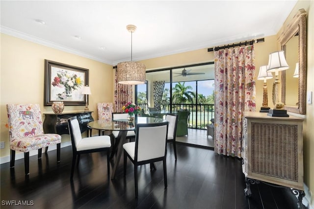 dining space with dark hardwood / wood-style flooring, ceiling fan, and crown molding