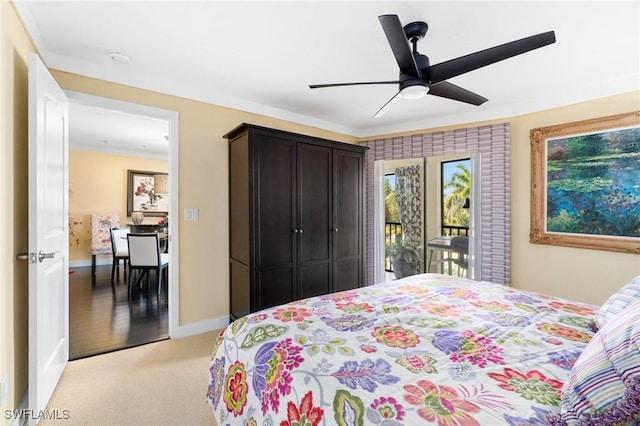 bedroom with ceiling fan, ornamental molding, light carpet, and access to outside