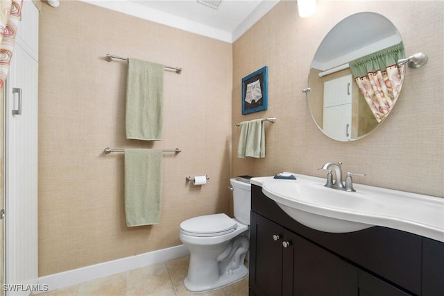 bathroom featuring tile patterned floors, vanity, and toilet