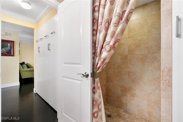 bathroom with a shower with curtain and ornamental molding