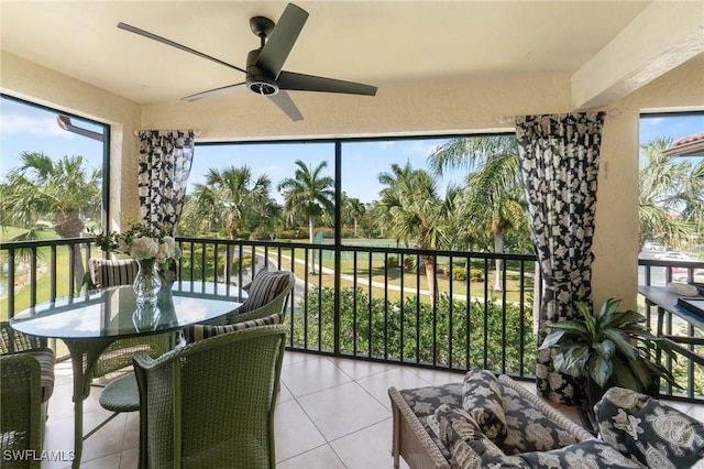 sunroom / solarium with a wealth of natural light and ceiling fan