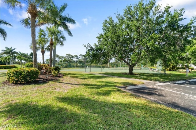 view of yard with tennis court