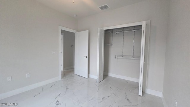 unfurnished bedroom featuring a closet