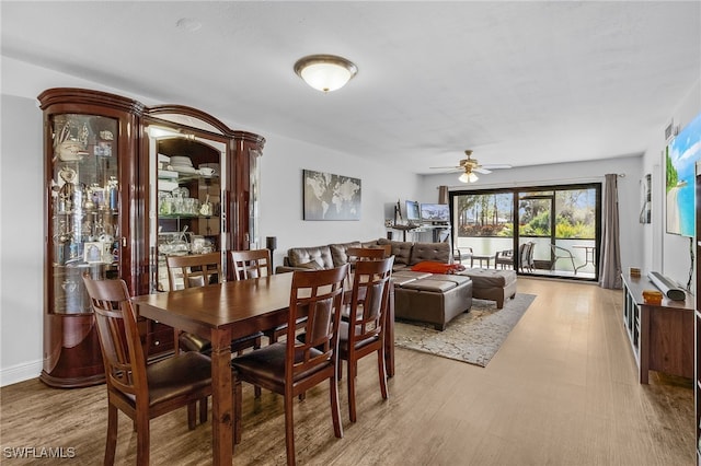 dining room featuring ceiling fan and light hardwood / wood-style flooring