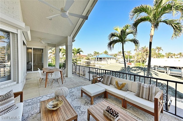 balcony featuring an outdoor hangout area and ceiling fan