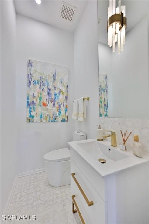 bathroom with tile patterned floors, toilet, and vanity