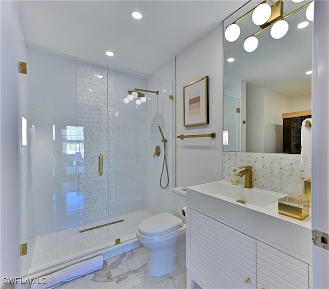 bathroom with toilet, tasteful backsplash, an enclosed shower, a chandelier, and vanity