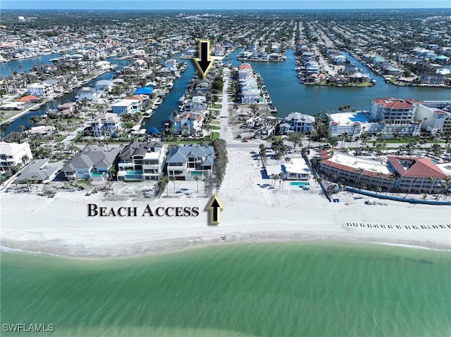 aerial view with a beach view and a water view