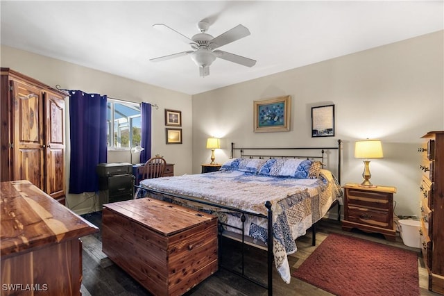 bedroom with ceiling fan and dark hardwood / wood-style flooring