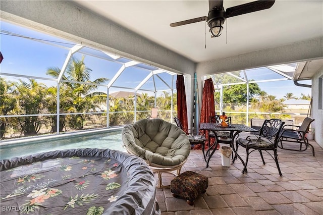 view of patio with glass enclosure and a pool with hot tub