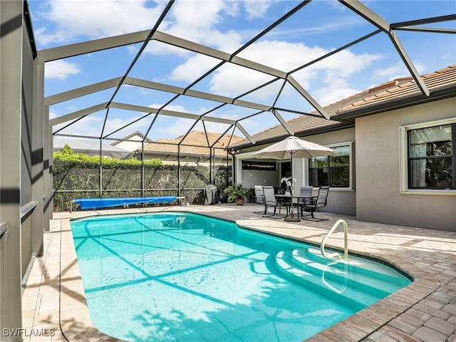 view of pool featuring a patio area and a lanai