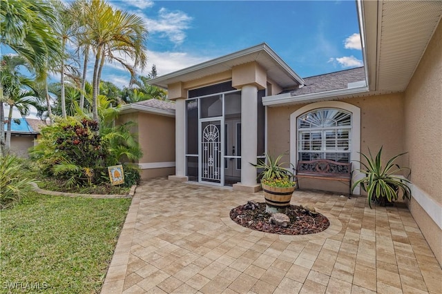 entrance to property with a patio area