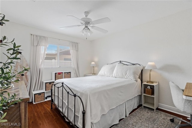 bedroom featuring ceiling fan and dark hardwood / wood-style floors