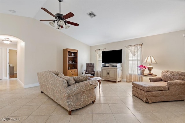 tiled living room featuring ceiling fan and lofted ceiling