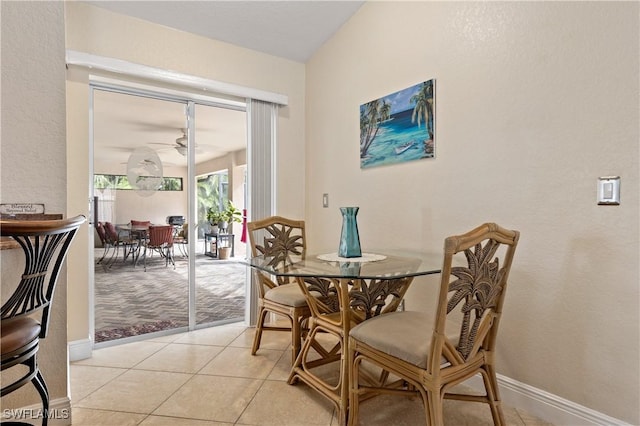 dining area with ceiling fan and light tile patterned floors