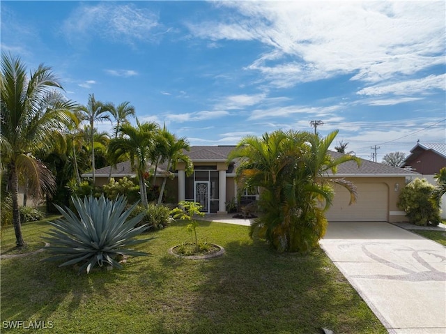 view of front of home with a front lawn and a garage