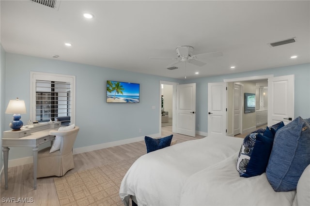 bedroom with ceiling fan and light hardwood / wood-style floors